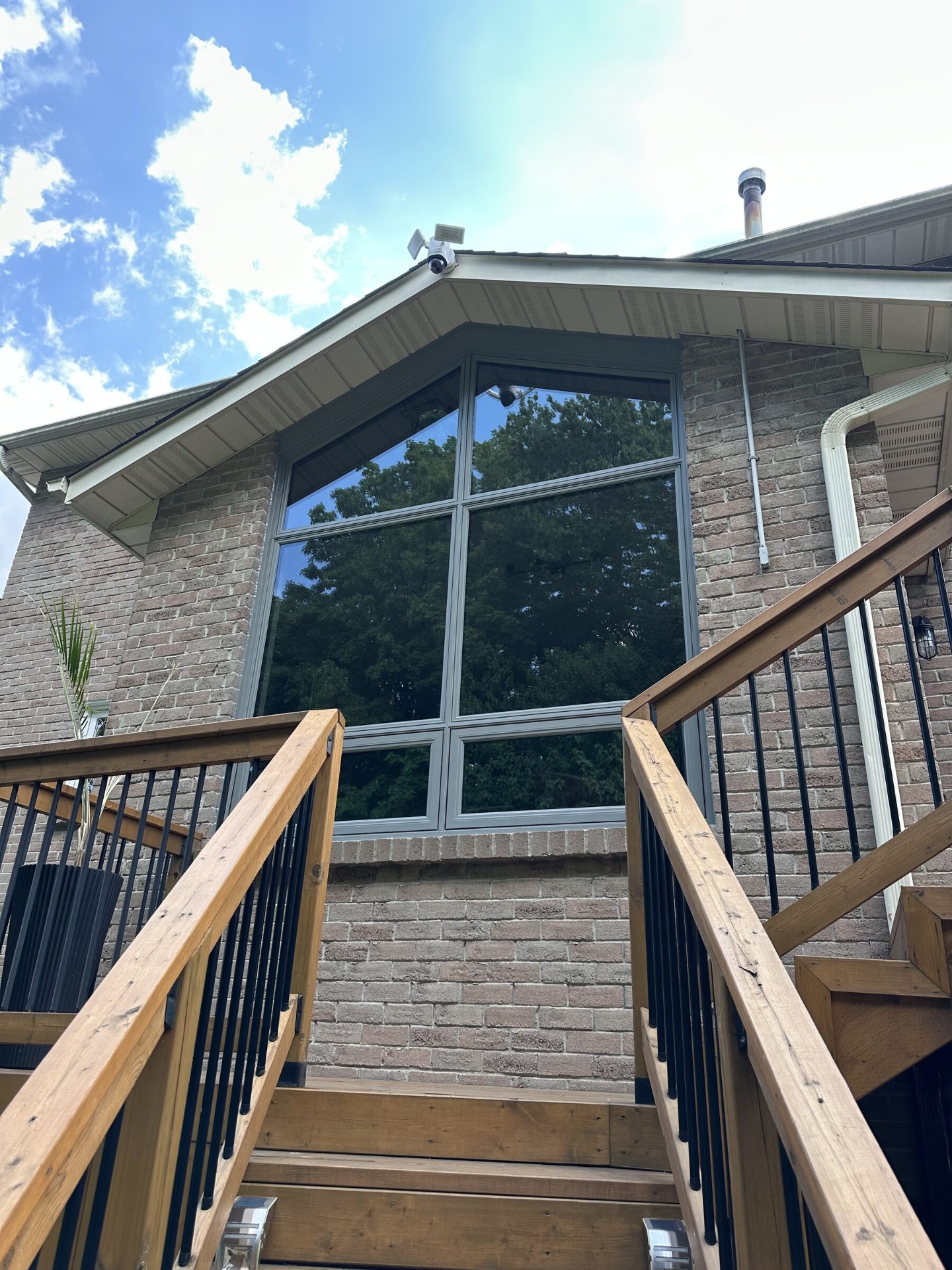 Full-height gable window wall installed by Northern Views